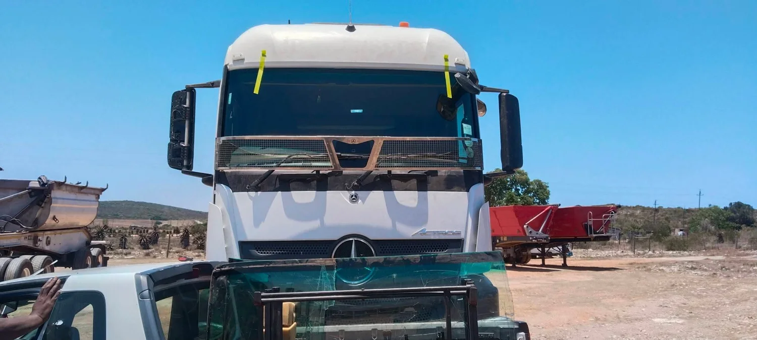Truck windscreen with fitting tape along the upper edge